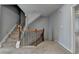 Carpeted staircase with wooden banister and iron spindles leading to the upper level at 3351 Vintage Se Cir, Smyrna, GA 30080