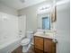 Cozy bathroom features a tub with shower and classic vanity at 1934 Patton Pl, Lithonia, GA 30058