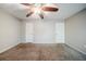 Peaceful bedroom offering neutral décor, wall-to-wall carpeting, and a modern ceiling fan at 1934 Patton Pl, Lithonia, GA 30058