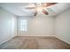 Calm bedroom featuring neutral paint, plush carpet, and a stylish ceiling fan at 1934 Patton Pl, Lithonia, GA 30058