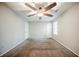 Inviting bedroom with neutral walls, plush carpeting, and a contemporary ceiling fan at 1934 Patton Pl, Lithonia, GA 30058