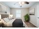 Bedroom featuring neutral walls, carpet flooring, a ceiling fan, decor, and a window at 1934 Patton Pl, Lithonia, GA 30058