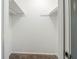 Empty walk-in closet with carpeted floor and rod and shelf storage system at 1934 Patton Pl, Lithonia, GA 30058