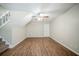 Open living area with hardwood floors, stairs, and a ceiling fan at 1934 Patton Pl, Lithonia, GA 30058