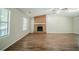 Spacious living room featuring a brick fireplace, vaulted ceilings, and natural light at 1934 Patton Pl, Lithonia, GA 30058