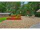 Gravel-covered outdoor living area features raised garden beds and provides a relaxing atmosphere at 2624 Lake Erin Drive Dr, Tucker, GA 30084