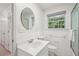 Bright and modern bathroom featuring a sink, toilet, and walk-in shower at 2624 Lake Erin Drive Dr, Tucker, GA 30084