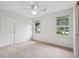 Bedroom with natural light, a ceiling fan, and a closet at 2624 Lake Erin Drive Dr, Tucker, GA 30084