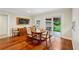 Bright dining room with hardwood floors and sliding door access to the outdoor patio at 2624 Lake Erin Drive Dr, Tucker, GA 30084