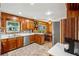 Bright kitchen featuring wooden cabinets, modern stainless steel appliances, and a stylish tile floor at 2624 Lake Erin Drive Dr, Tucker, GA 30084