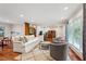 Bright living room featuring hardwood floors, modern furniture, and large windows providing ample natural light at 2624 Lake Erin Drive Dr, Tucker, GA 30084