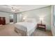 Spacious main bedroom with neutral walls, ceiling fan, and windows providing ample natural light at 2624 Lake Erin Drive Dr, Tucker, GA 30084