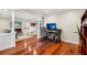 Bright home office with hardwood floors, featuring an open view into the adjacent living area at 2624 Lake Erin Drive Dr, Tucker, GA 30084