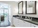 Bathroom featuring granite countertops and dual sinks at 2795 Peachtree Ne Rd # 1009, Atlanta, GA 30305