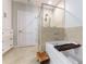Modern bathroom showcasing a soaking tub with a tiled shower and natural stone tile flooring at 2795 Peachtree Ne Rd # 1009, Atlanta, GA 30305