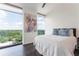 Cozy bedroom featuring lots of light, wood floors and city views at 2795 Peachtree Ne Rd # 1009, Atlanta, GA 30305