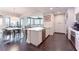 Open kitchen boasts stainless steel appliances, a breakfast bar, and sleek white cabinetry at 2795 Peachtree Ne Rd # 1009, Atlanta, GA 30305