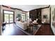 Elegant living room with fireplace, built-in shelving, and ample seating, perfect for relaxation at 2795 Peachtree Ne Rd # 1009, Atlanta, GA 30305