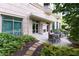 Outdoor patio with lush greenery, comfortable seating and outdoor fireplace at 2795 Peachtree Ne Rd # 1009, Atlanta, GA 30305
