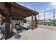 Outdoor patio with pergola, fireplace, seating, and tennis court at 2795 Peachtree Ne Rd # 1009, Atlanta, GA 30305