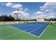 Well-maintained tennis court with pristine blue surface and surrounding greenery at 2795 Peachtree Ne Rd # 1009, Atlanta, GA 30305