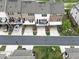 View of townhomes with rear garages, driveways, and street parking at 416 Montclair Ct, Woodstock, GA 30188