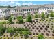An aerial view of townhomes in a community featuring manicured landscaping at 416 Montclair Ct, Woodstock, GA 30188