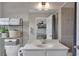 Well-lit bathroom features a vanity, toilet, and shower-tub combo at 416 Montclair Ct, Woodstock, GA 30188