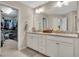 Bathroom featuring dual sinks, granite countertops, and walk-in closet at 416 Montclair Ct, Woodstock, GA 30188