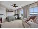 Bedroom with large windows providing scenic views and a cozy seating area at 416 Montclair Ct, Woodstock, GA 30188