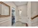 Hallway with hardwood floors leads to bathroom and home gym at 416 Montclair Ct, Woodstock, GA 30188