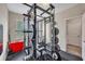 Home gym with weights, mirrors, and natural light for effective workouts at 416 Montclair Ct, Woodstock, GA 30188