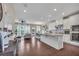 Open floor plan with a modern kitchen and inviting dining area with plenty of sunlight at 416 Montclair Ct, Woodstock, GA 30188