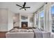 Inviting living room featuring a fireplace, built-ins, and large windows with natural light at 416 Montclair Ct, Woodstock, GA 30188