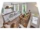Spacious living room with hardwood floors, large windows, a ceiling fan, and a comfortable seating area at 416 Montclair Ct, Woodstock, GA 30188