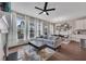 Bright living room with large windows, fireplace, and an adjacent dining area at 416 Montclair Ct, Woodstock, GA 30188