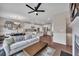 Spacious open floor plan with hardwood floors and a modern ceiling fan at 416 Montclair Ct, Woodstock, GA 30188