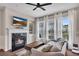 Cozy living room with a fireplace, large windows and natural light at 416 Montclair Ct, Woodstock, GA 30188