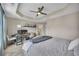 Inviting main bedroom with neutral colors, tray ceilings, and a desk area at 416 Montclair Ct, Woodstock, GA 30188