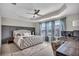 Main bedroom featuring a tray ceiling, ample natural light, and a work space at 416 Montclair Ct, Woodstock, GA 30188