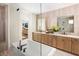 Bright bathroom with a soaking tub and light wood cabinetry at 6930 Pond View Dr, Cumming, GA 30028
