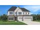 Stunning two-story home featuring a white brick facade, a well-manicured lawn, and an attached two-car garage at 6930 Pond View Dr, Cumming, GA 30028