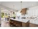 Modern kitchen with stainless steel appliances, a center island with seating, and a dining area at 6930 Pond View Dr, Cumming, GA 30028