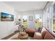 Comfortable living room with kitchenette featuring a cozy seating area and large windows with natural light at 6930 Pond View Dr, Cumming, GA 30028
