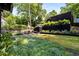 The backyard offers a dining area and an ample lawn at 819 Belgrade Ne Ave, Atlanta, GA 30306