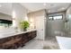 Modern bathroom with a double vanity, sleek fixtures, and a glass-enclosed shower for a spa-like experience at 819 Belgrade Ne Ave, Atlanta, GA 30306