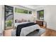 Serene bedroom with neutral tones, ample natural light, hardwood floors, and a cozy rug at 819 Belgrade Ne Ave, Atlanta, GA 30306