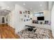 Bright workout room featuring workout bench, entertainment center, wood floors, and modern artwork at 819 Belgrade Ne Ave, Atlanta, GA 30306