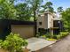 Modern home with detached garage and lush landscaping at 819 Belgrade Ne Ave, Atlanta, GA 30306