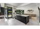 Open floor plan with modern island kitchen, stainless appliances, and a connected living area at 819 Belgrade Ne Ave, Atlanta, GA 30306